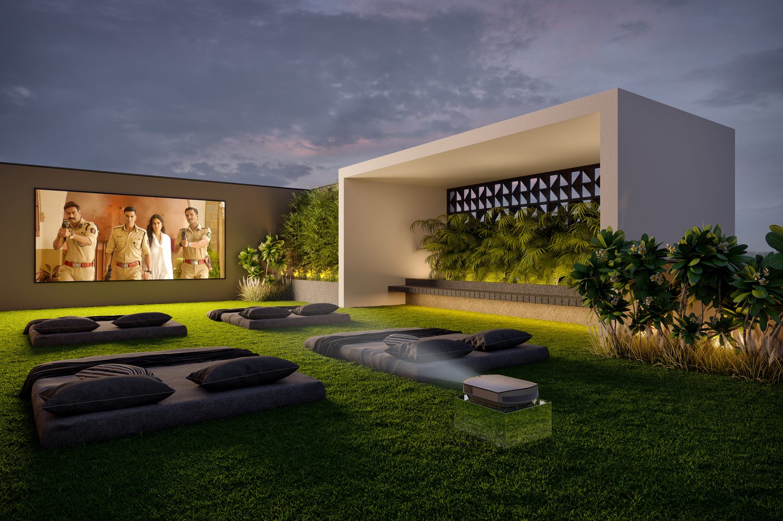 Open-sky theatre on the Shivalik Skypark terrace: lawn with floor cushions facing a screen, architect's render
