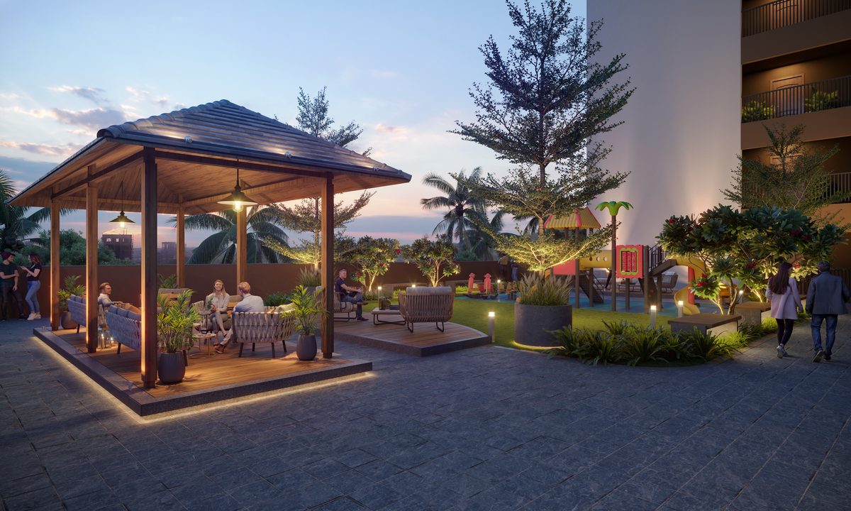 Pavilion with seating, lawn and play area lit in the evening at Shivalik Skygreen, architect's render